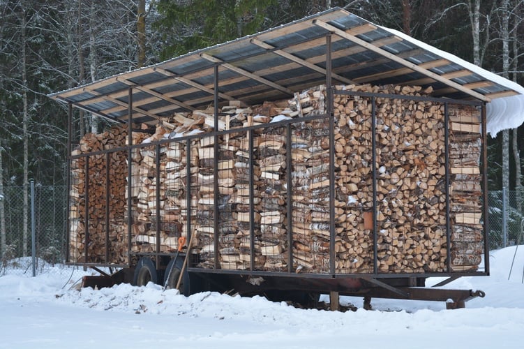 Drying firewood under a canopy in Finland.